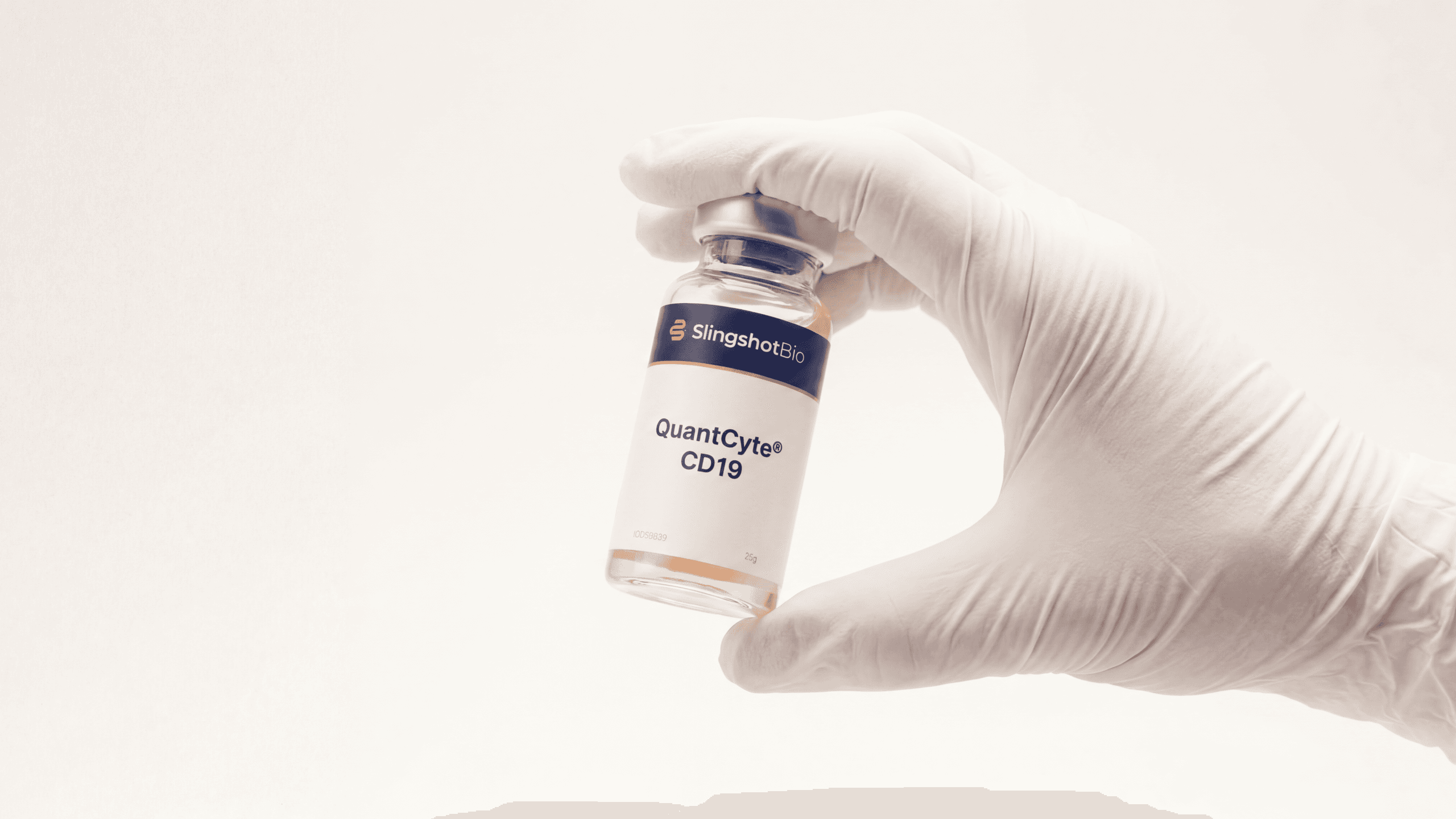 Gloved hand holding a Slingshot Bio vial